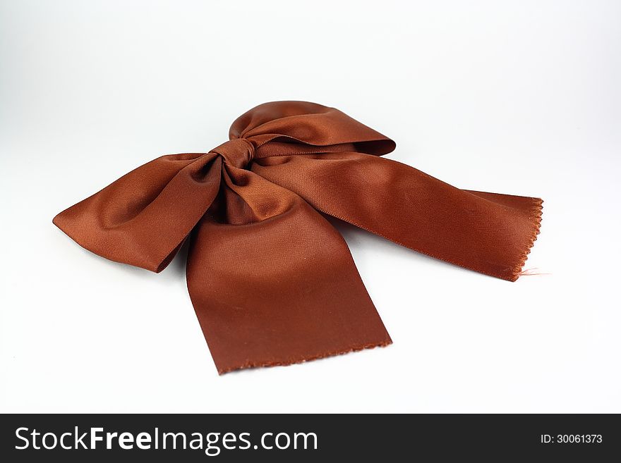 Brown ribbon on white background