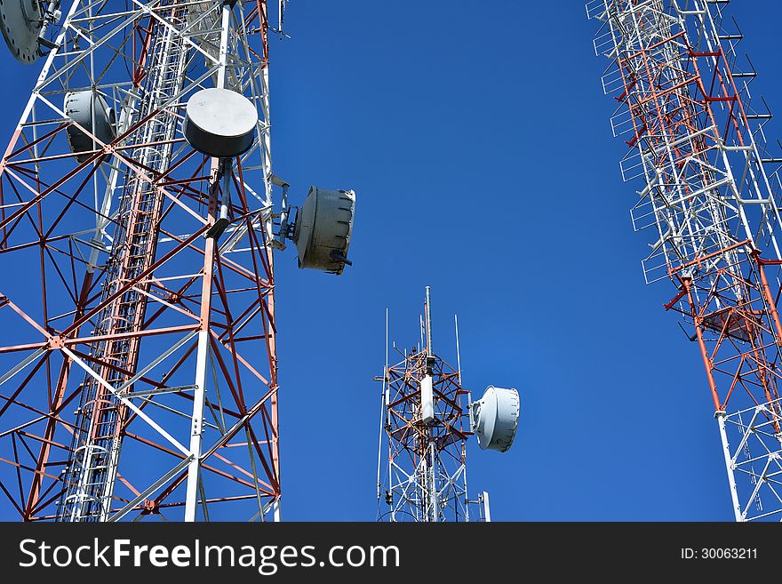 Telecommunication tower with a sunlight. Used to transmit television signals.