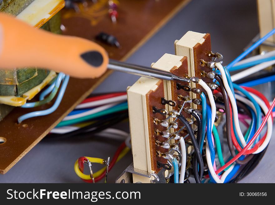 Electric device being repaired by an electrician