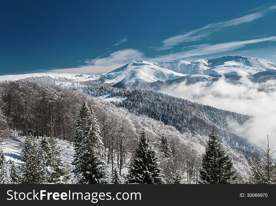 Winter mountain scenery and snow covered peaks in Europe in January, in the Transylvanian Alps