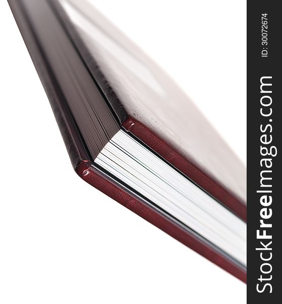 Side view of book with leatherette cover on white backgrounds