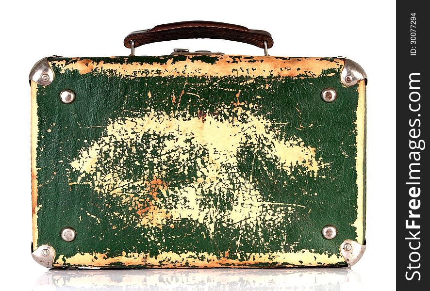 Old green shabby suitcase