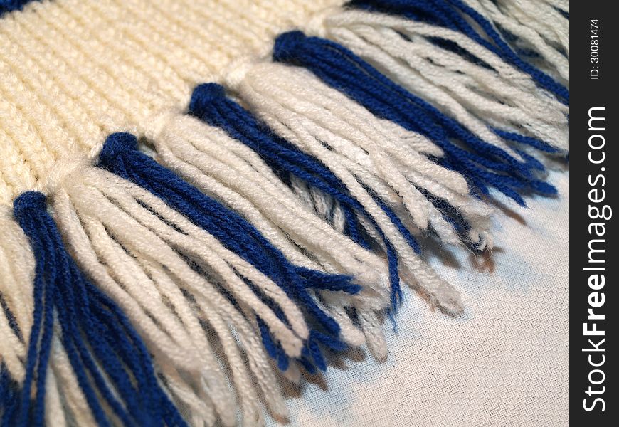 Close up knit scarf fringe border