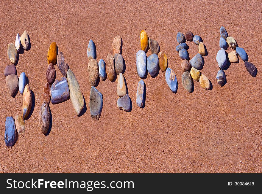 Sahara written on beach