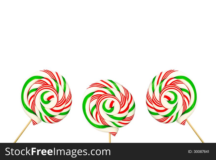 Three Sugar Lollipops In White Green And Red Isolated On White B