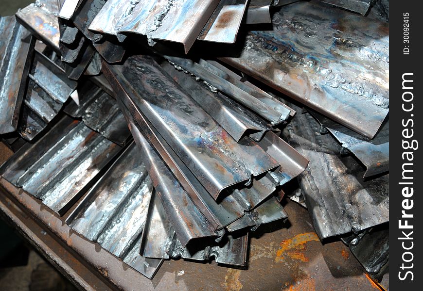 Pile of scrap metal in workshop. Pile of scrap metal in workshop