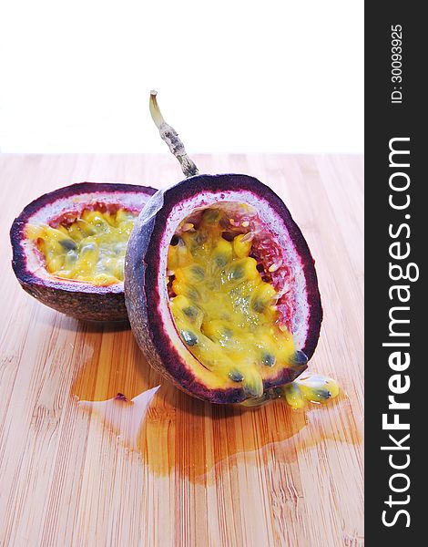 Cut passionfruit on a chopping board. Cut passionfruit on a chopping board