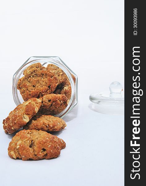 Traditional anzac (oat) biscuits in a glass jar. Traditional anzac (oat) biscuits in a glass jar