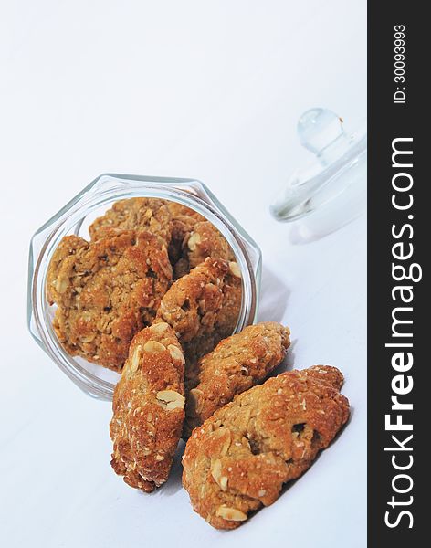 Traditional anzac (oat) biscuits in a glass jar. Traditional anzac (oat) biscuits in a glass jar