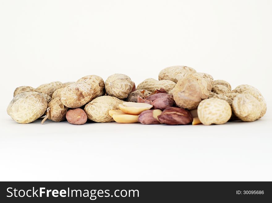 Some groundnuts front the white background.