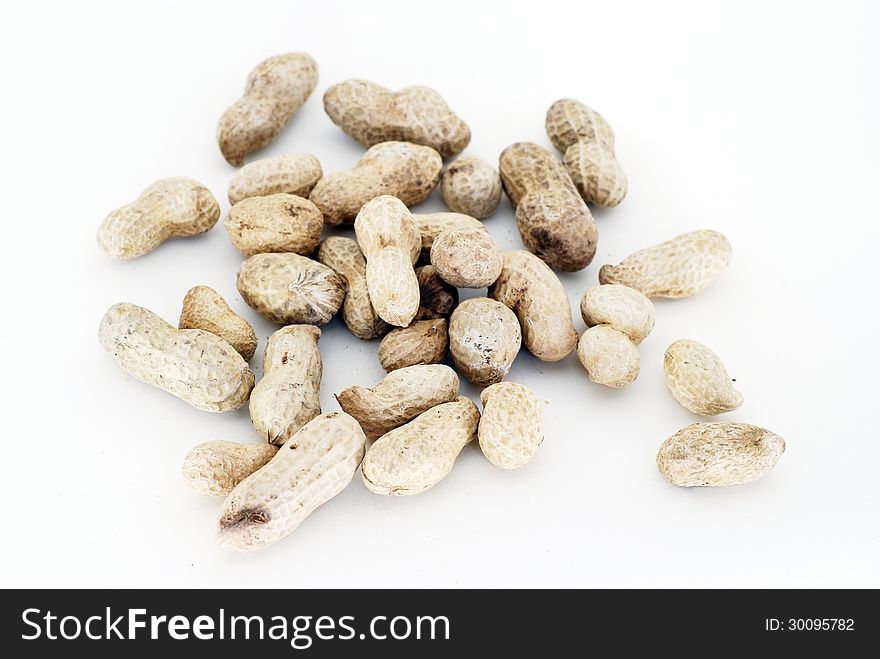 Some groundnuts front the white background.