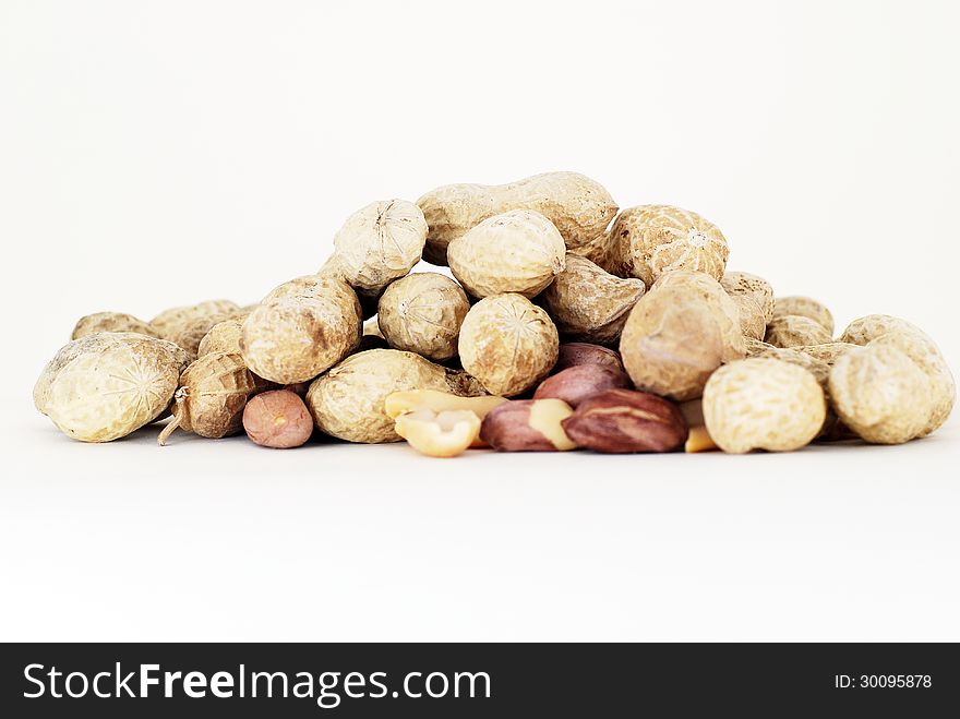 Some groundnuts front the white background.