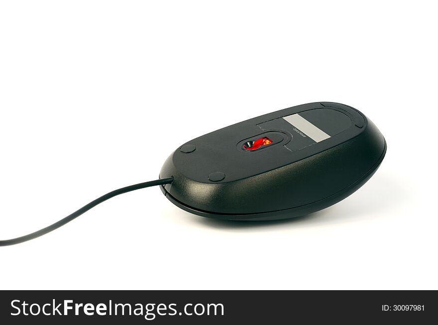 Black computer mouse in connected position upturned with its red light on, isolated on white. Black computer mouse in connected position upturned with its red light on, isolated on white.