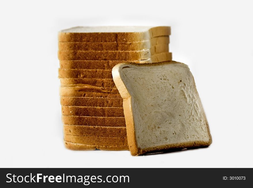 Many stacked slices of sandwich bread. Many stacked slices of sandwich bread