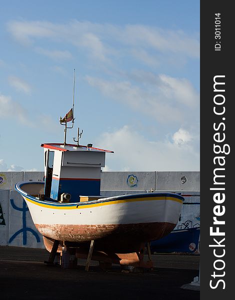 A fishing boat on the dockside. A fishing boat on the dockside