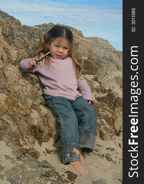 Young girl relaxing at the Oregon coast. Young girl relaxing at the Oregon coast.