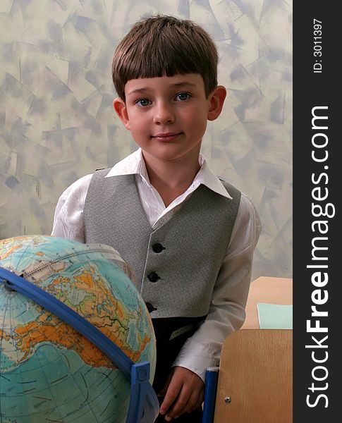 Portrait of the schoolboy with the globe. Portrait of the schoolboy with the globe