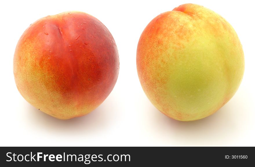 One nectarine. two views. isolated on white.