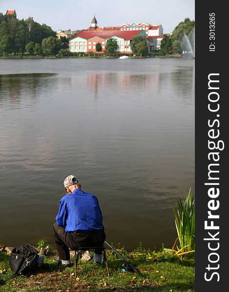 Fishing time... older angler on a lake,