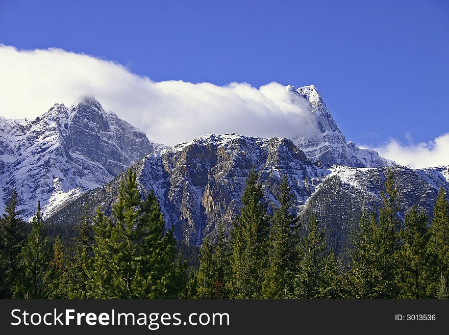 Cloud cover clinging to the side of a mountain. Cloud cover clinging to the side of a mountain.