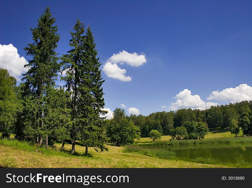 Landscape with blue sky, clouds, forest and lake. Landscape with blue sky, clouds, forest and lake