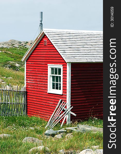 Rustic red building on the Bonavista Lighthouse grounds in Newfoundland, Nova Scotia, Canada - travel and tourism.