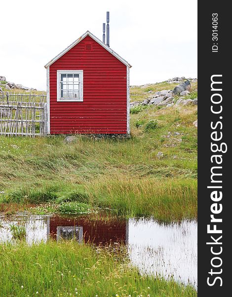 Rustic red building on the Bonavista Lighthouse grounds in Newfoundland, Nova Scotia, Canada - travel and tourism. Rustic red building on the Bonavista Lighthouse grounds in Newfoundland, Nova Scotia, Canada - travel and tourism.