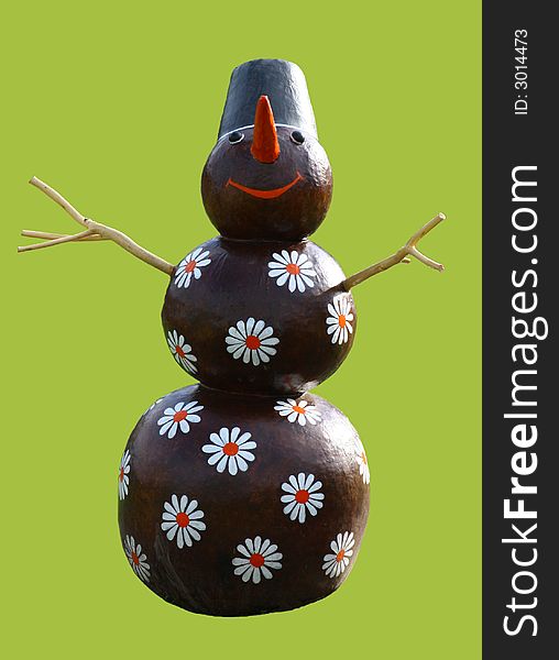Smiling chocolate snowman with camomiles isolated on green