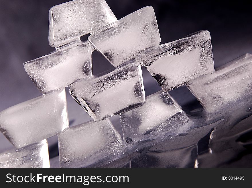Photo of pyramid made from ice cubes.