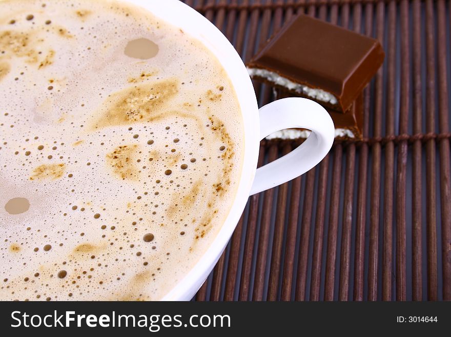 Cup of coffee with chocolate Frothy cappuccino coffee.