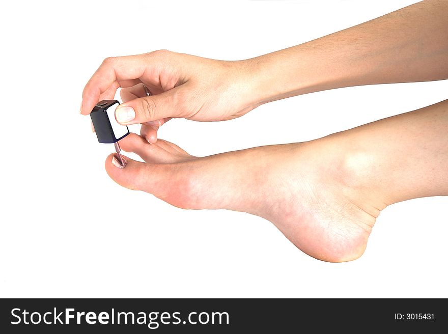 Woman applying nail polish on white background