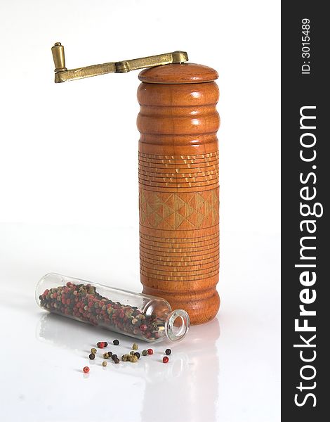 Jars of pepper and old pepper mill grinder