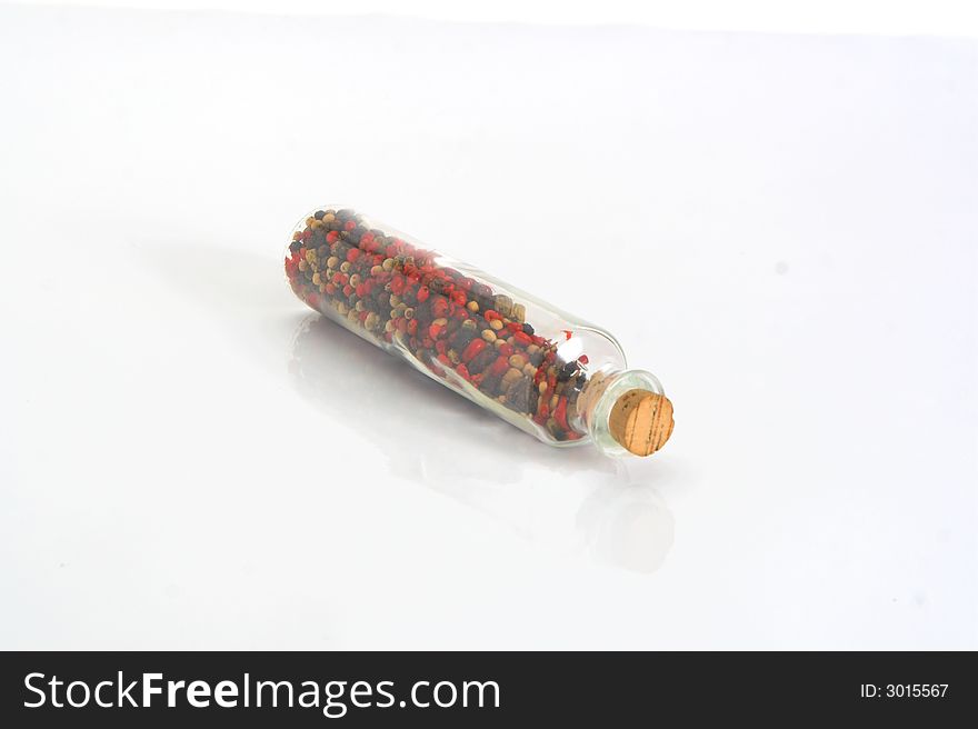 Jar of Pepper wid cork isolated on white