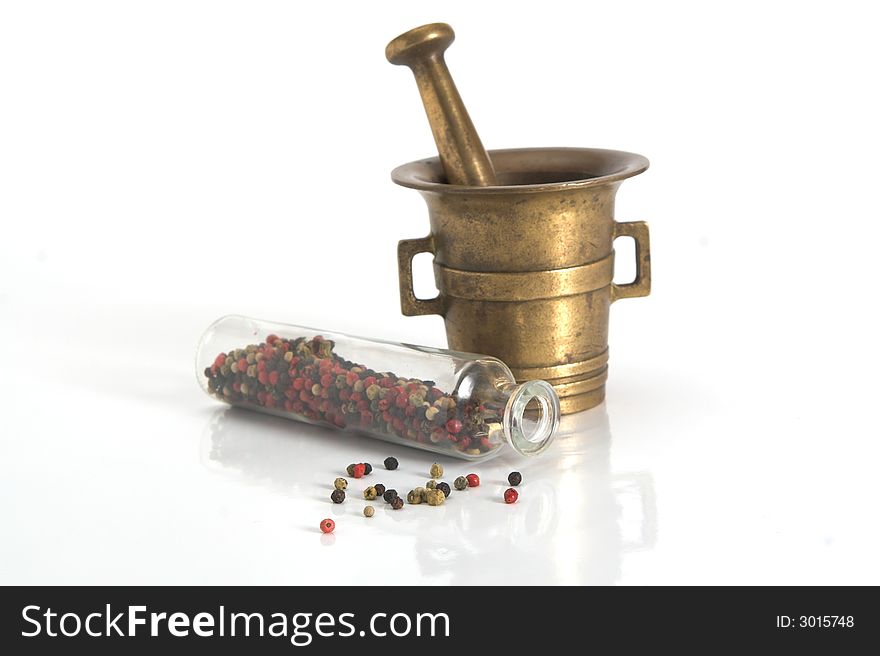 Very old grinder, mortar isolated on white with jar of pepper