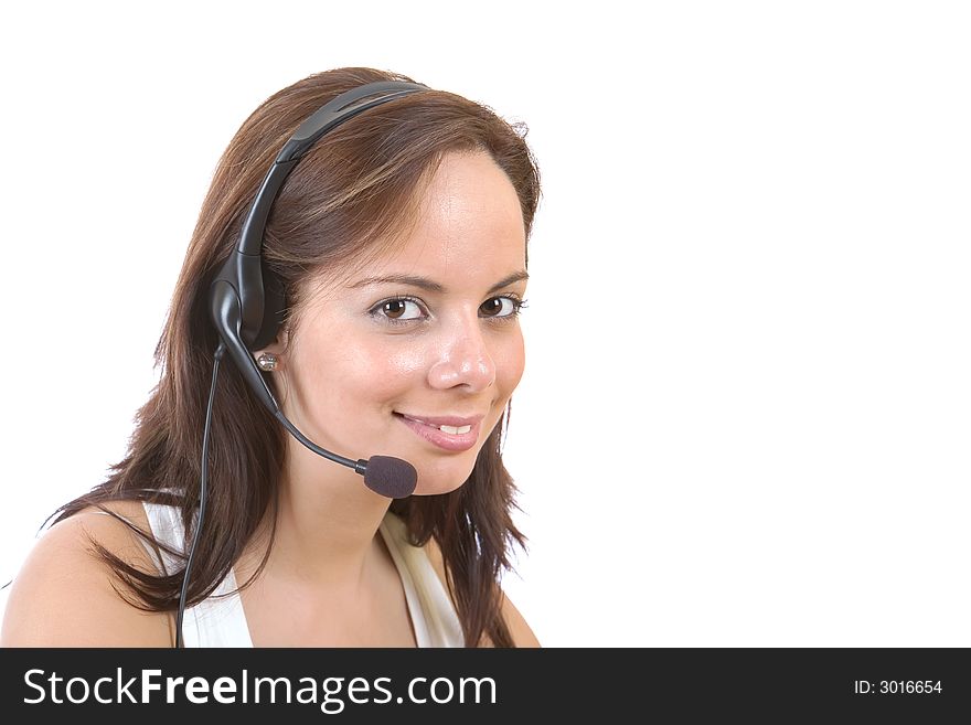 Beautiful customer representative with headset smiling during a telephone conversation - over a white background. Beautiful customer representative with headset smiling during a telephone conversation - over a white background