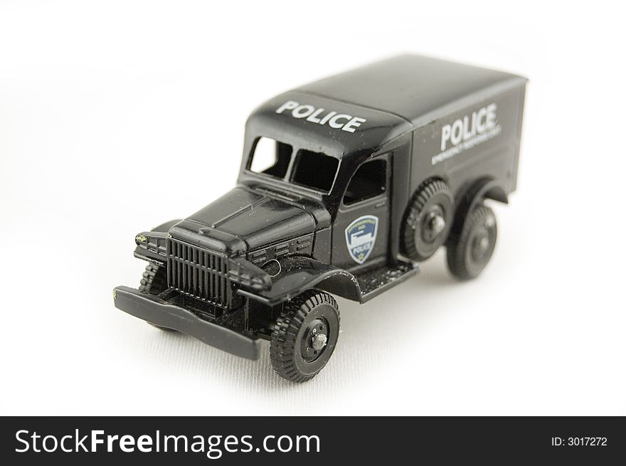 Small black policecar isolated on white