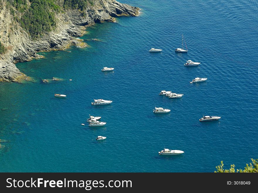 Boats on Ligurian Sea (the Mediterranean), near coast line, Cinque Terre National Park, Italy. Boats on Ligurian Sea (the Mediterranean), near coast line, Cinque Terre National Park, Italy.