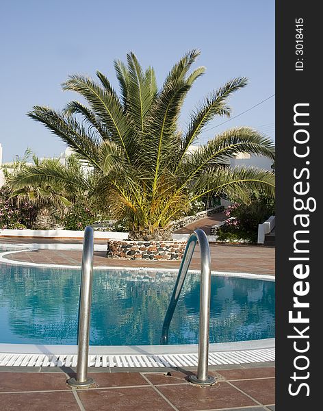 Swimming pool railing with tropical plant greek island santorini hotel. Swimming pool railing with tropical plant greek island santorini hotel