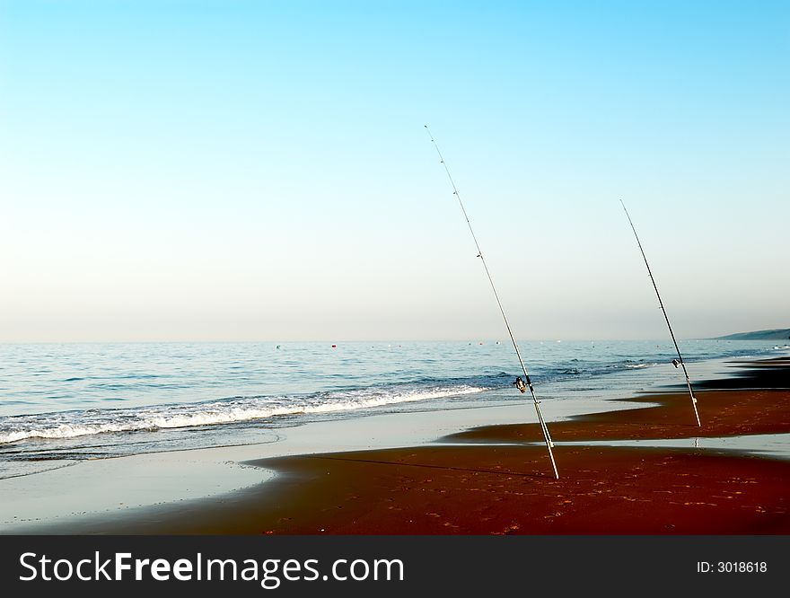 Fishing time on the ocean beach