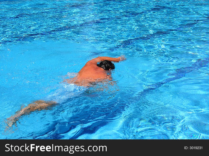 Young man in the swimming pool. Young man in the swimming pool
