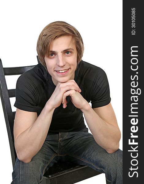 Portrait of handsome young smiling man in black clothes on white background. Portrait of handsome young smiling man in black clothes on white background