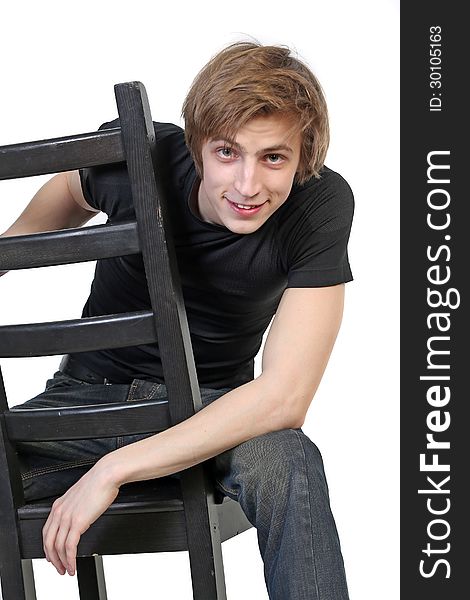 Portrait of handsome young smiling man in black clothes on white background. Portrait of handsome young smiling man in black clothes on white background