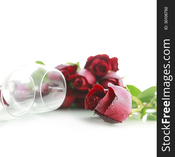 Red rose with wine glass on white background. Red rose with wine glass on white background