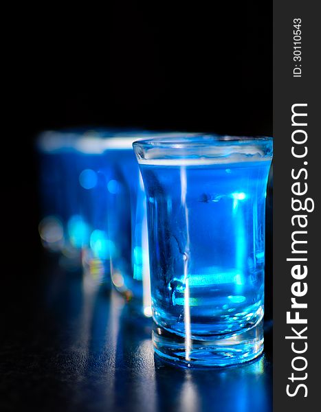 Shoot glasses with blue drink