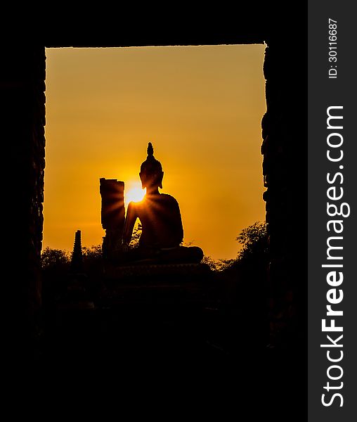 Buddha and pagoda after sunset, wat Phra sri sanphet temple, Ayutthaya, Thailand