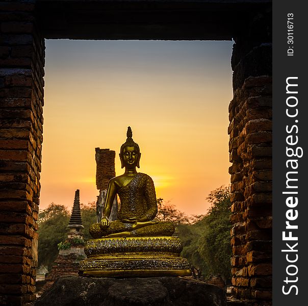 Buddha and pagoda after sunset, wat Phra sri sanphet temple, Ayutthaya, Thailand