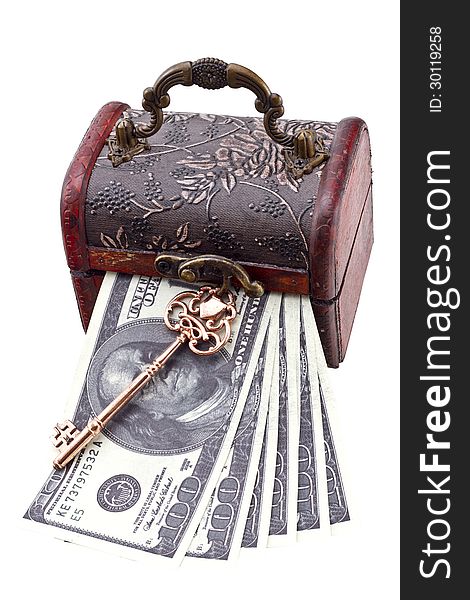 USA dollars in a wood treasure chest with old skeleton key isolated on white. USA dollars in a wood treasure chest with old skeleton key isolated on white.