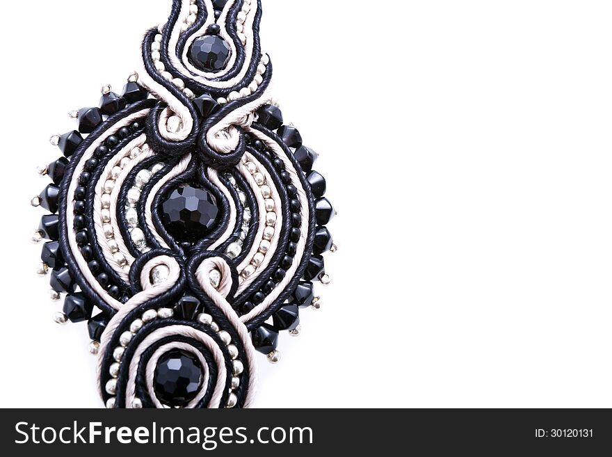 Soutache ornament detail with blank space isolated on white.