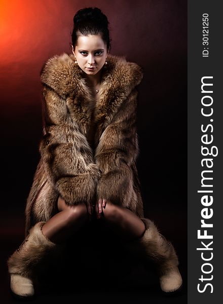 Woman in luxury winter fur coat