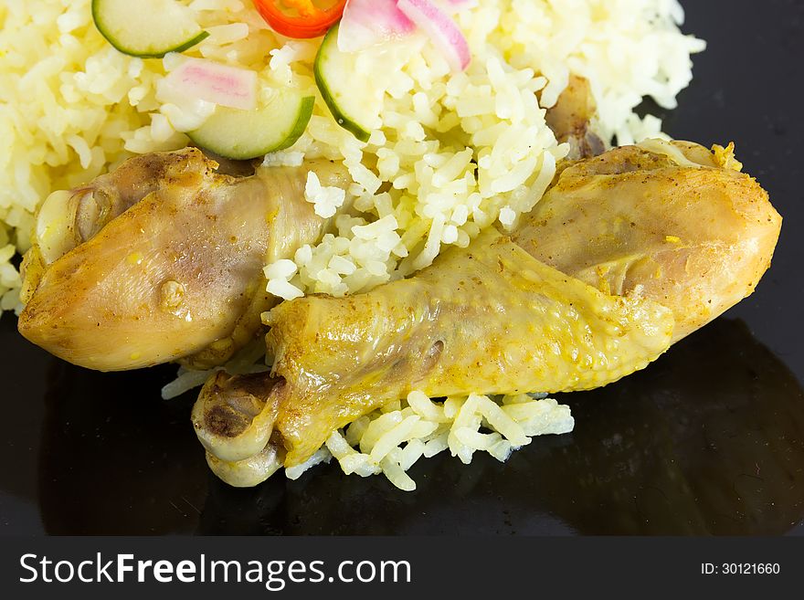 Kgawhmk chicken on a black plate
